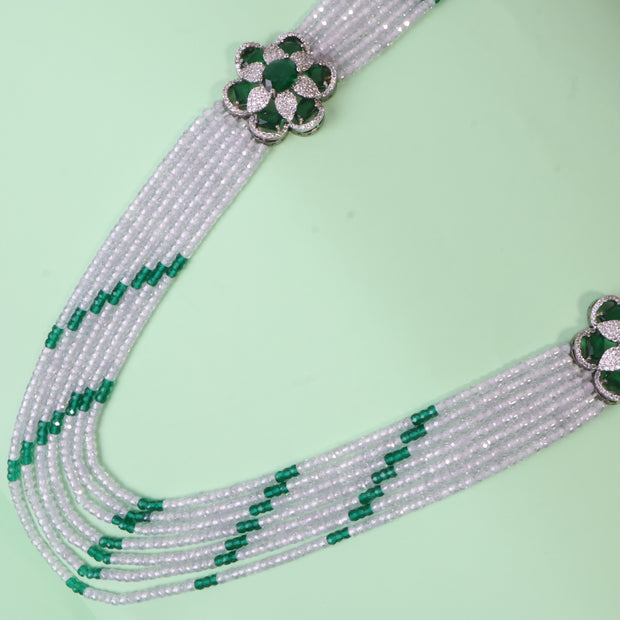 Elegant Multi-Strand Pearl Necklace with Emerald Floral Centrepiece